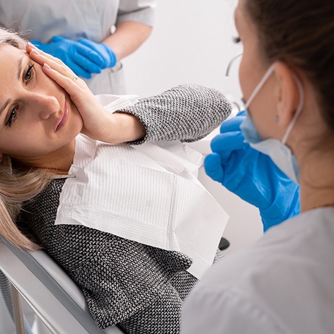 Concerned patient talking to her dentist